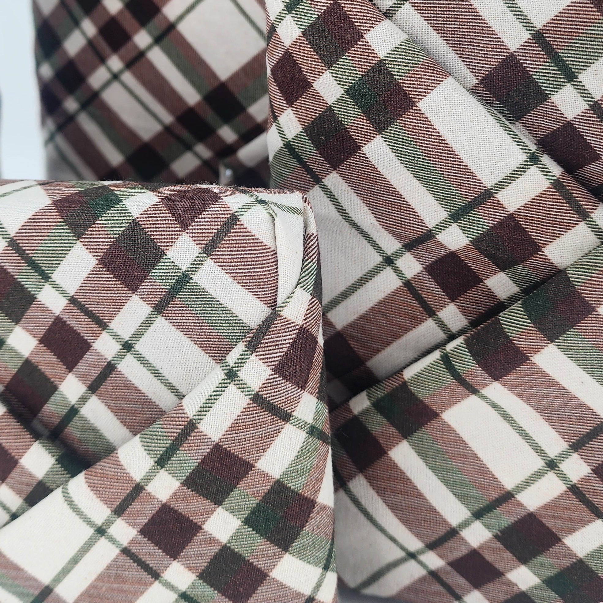 Furoshiki cotton gift wrap on on four gifts in brown and green tartan design