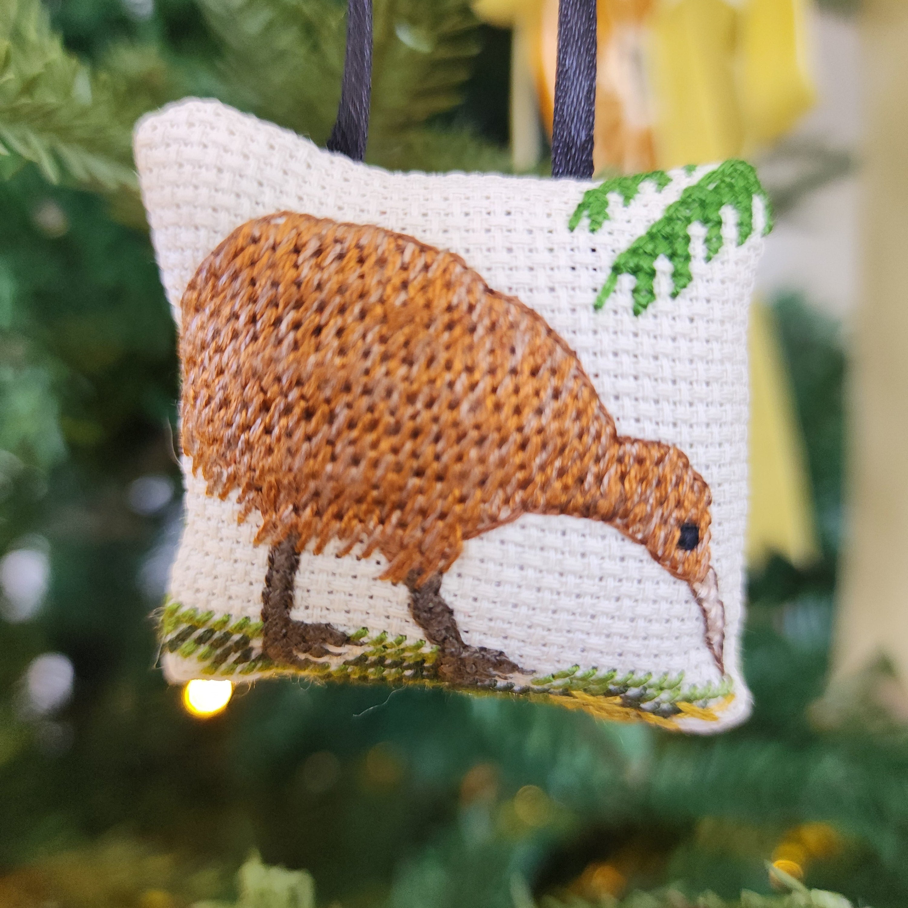 Cross-stitched ornament of a Kiwi bird. Kiwiana.