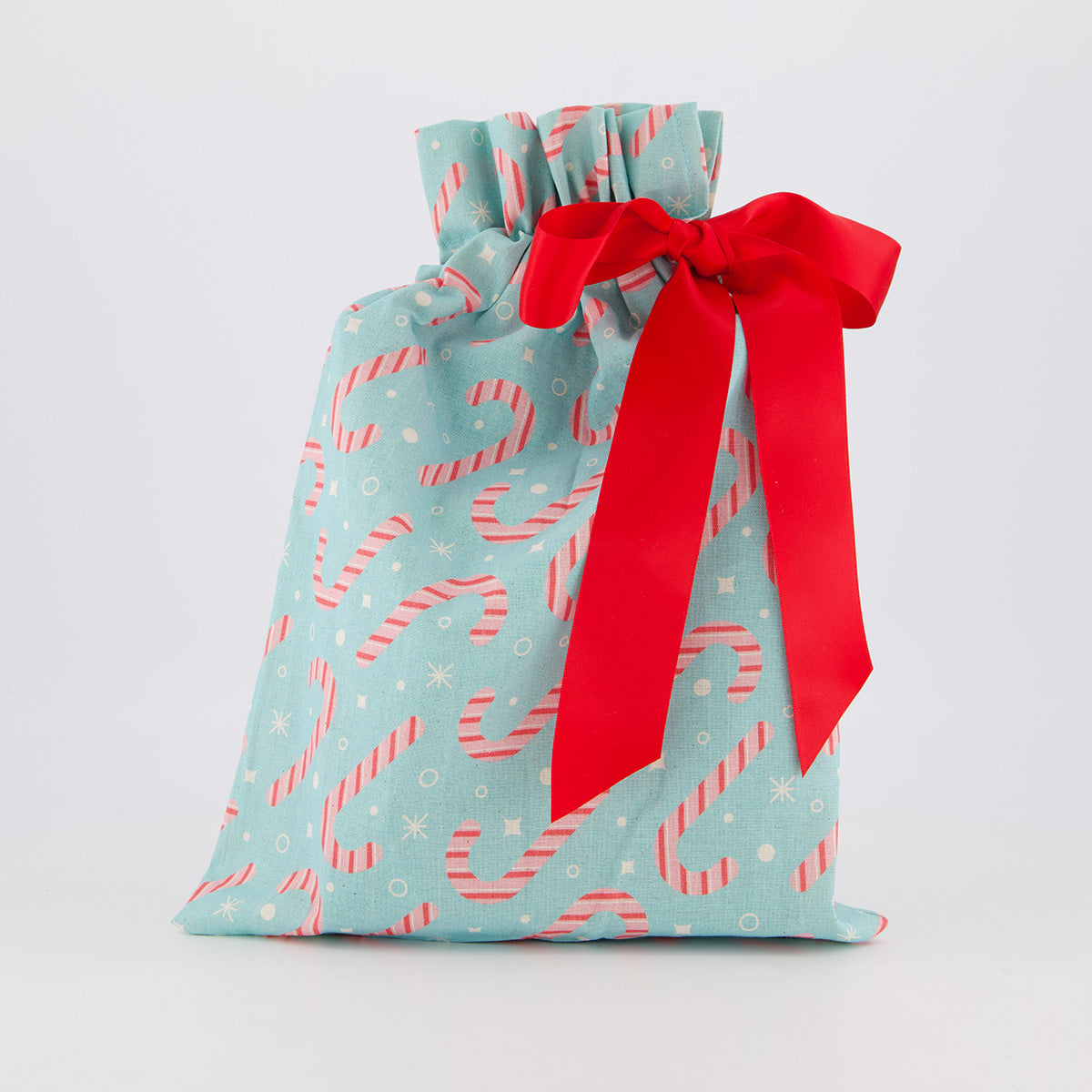 Book reusable gift bag — playful Papa Noel print in pink, red and green — handmade in Afghanistan
