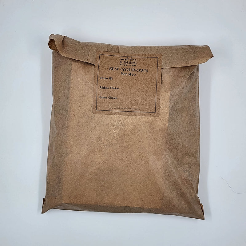 A photo of a set of Sew Your Own Gift Bags packaged up in a brown paper bag.