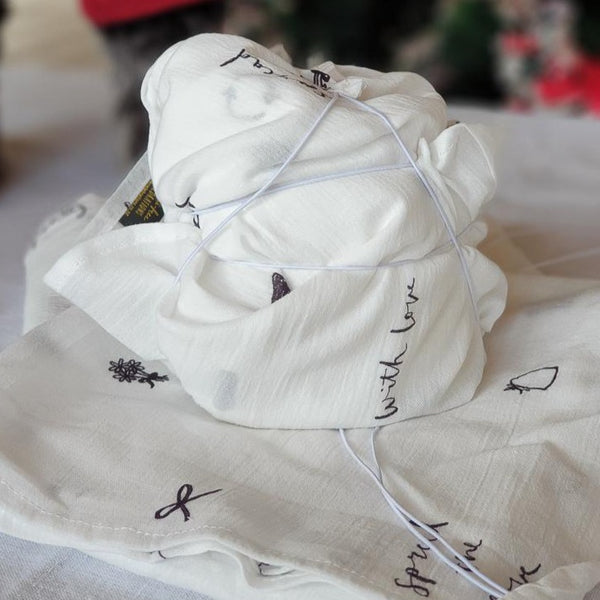 A photo showing a present wrapped in reusable tissue wrap