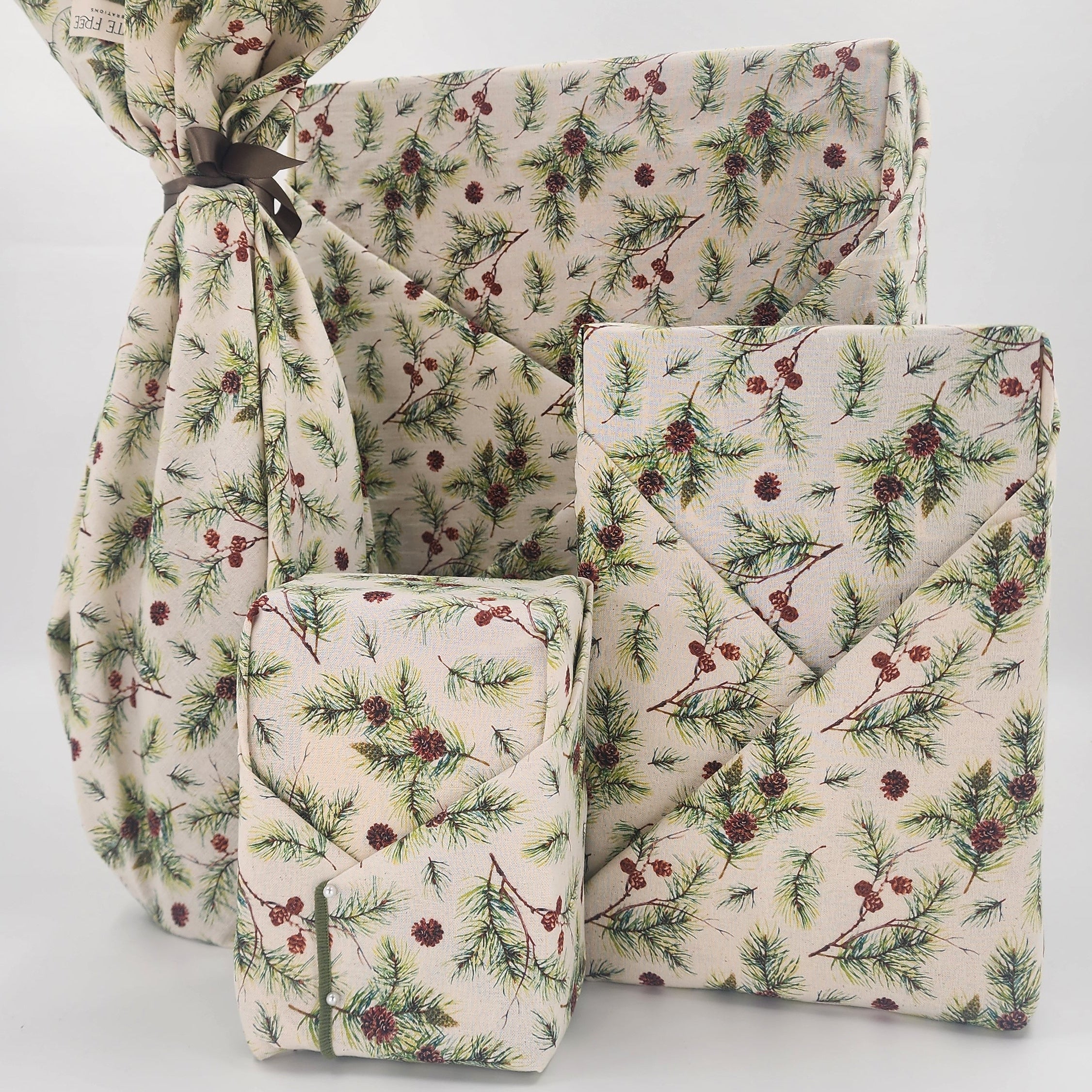 Furoshiki cotton gift wrap on natural cotton with green and borown pine boughs