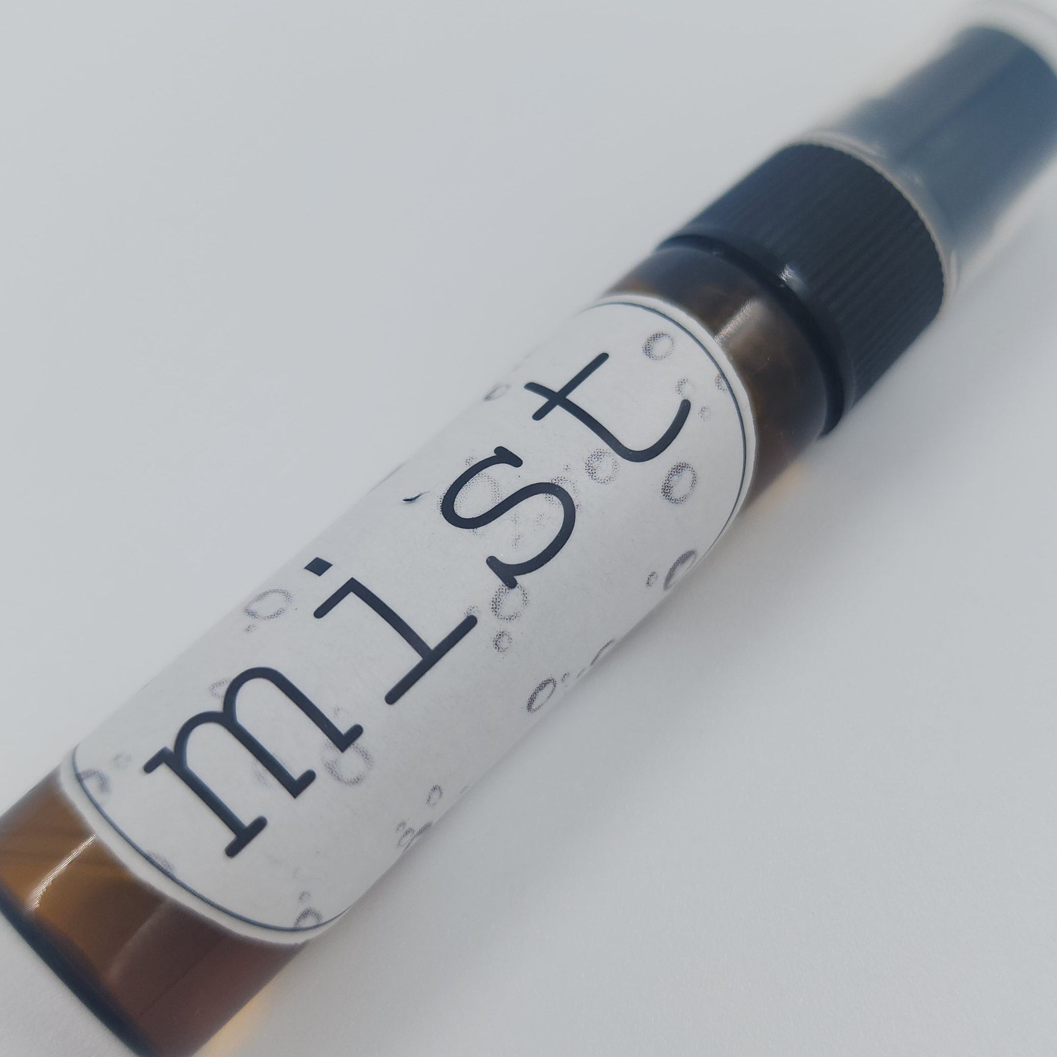 Small spray bottle labeled 'Mist' on a white background