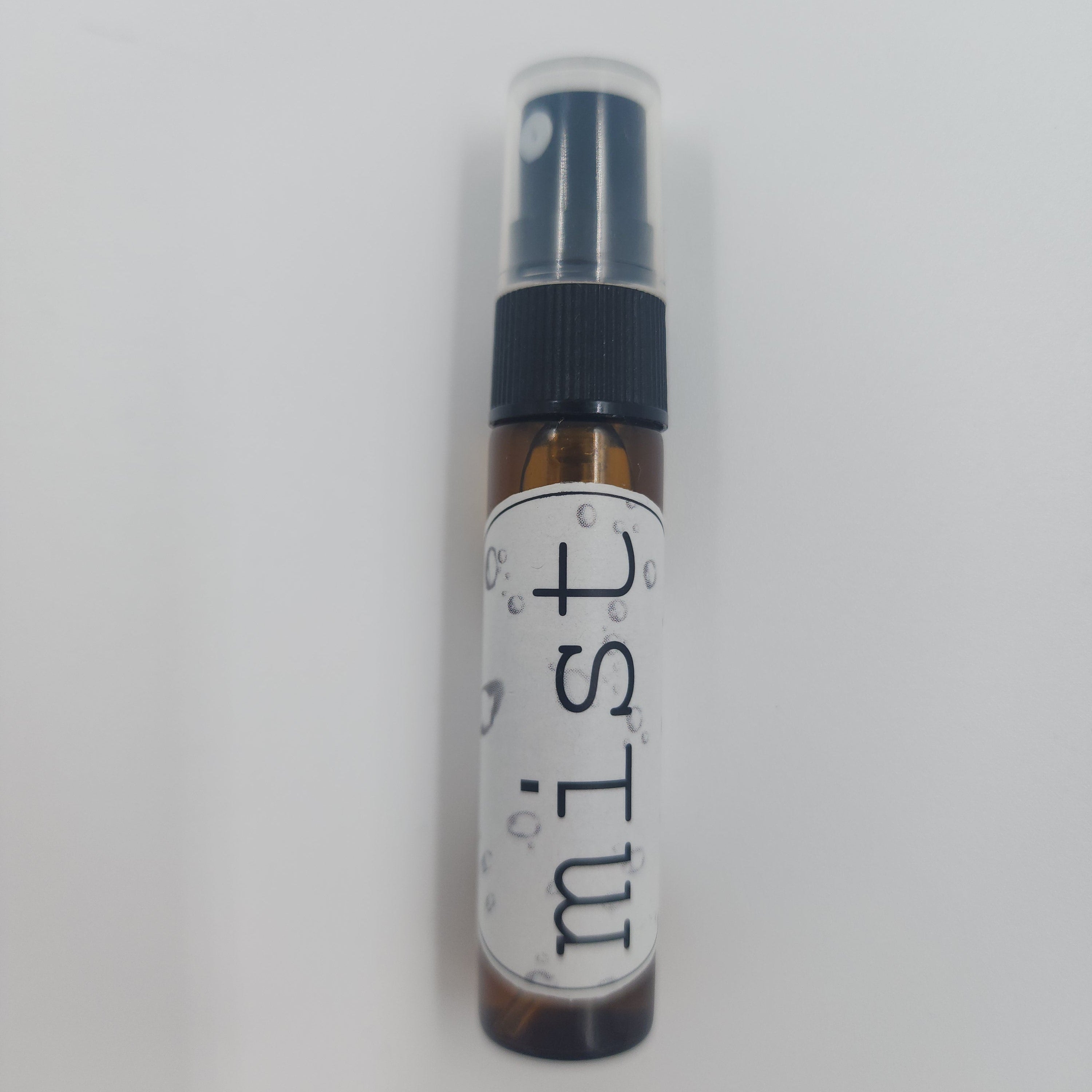 Small spray bottle labeled 'mist' on a white background