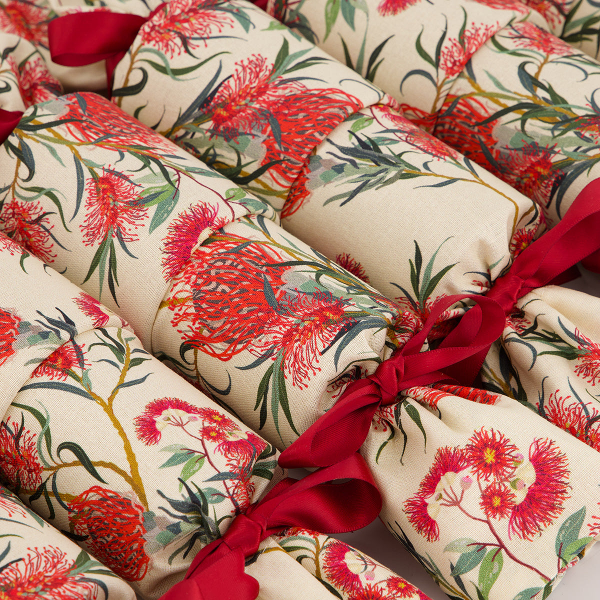 Eucalyptus reusable Christmas cracker — close-up of coral red pohutakawa bloom fabric detail