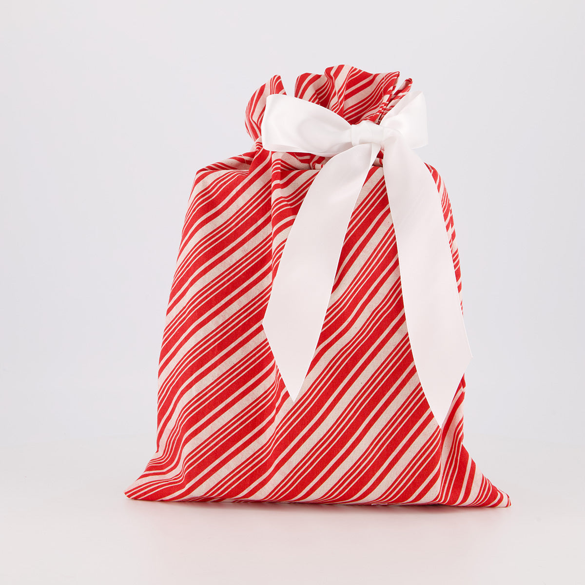 Book reusable gift bag — bold candy cane stripe in red and white — handmade in Afghanistan