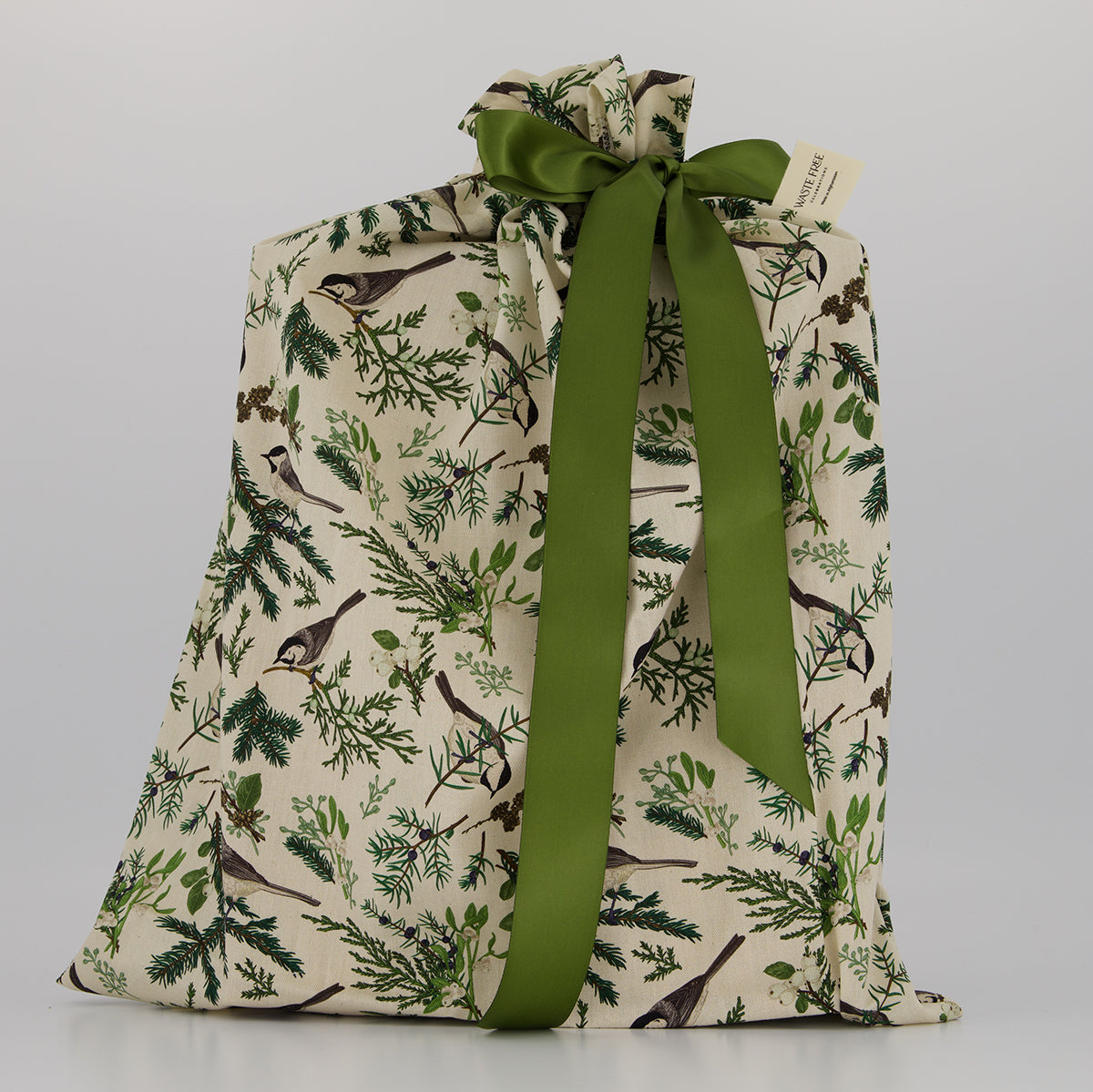 Large reusable gift bag — subtle woodland botanical print in green and cream — handmade in Afghanistan
