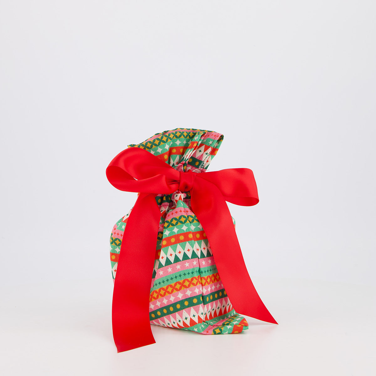 Small reusable gift bag — vibrant fiesta print in red, pink, green and gold — handmade in Afghanistan