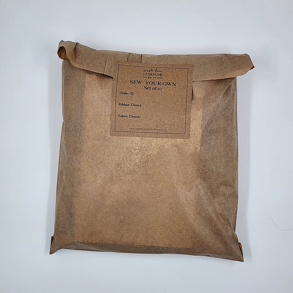 A photo showing a Sew Your Own Gift Bag set packaged up in a brown paper bag.