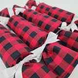 Set of four Re-Crackers (reusable Christmas Crackers or Bon Bons) in American Plaid. This design has red and black checked fabric finished with a white satin ribbon.