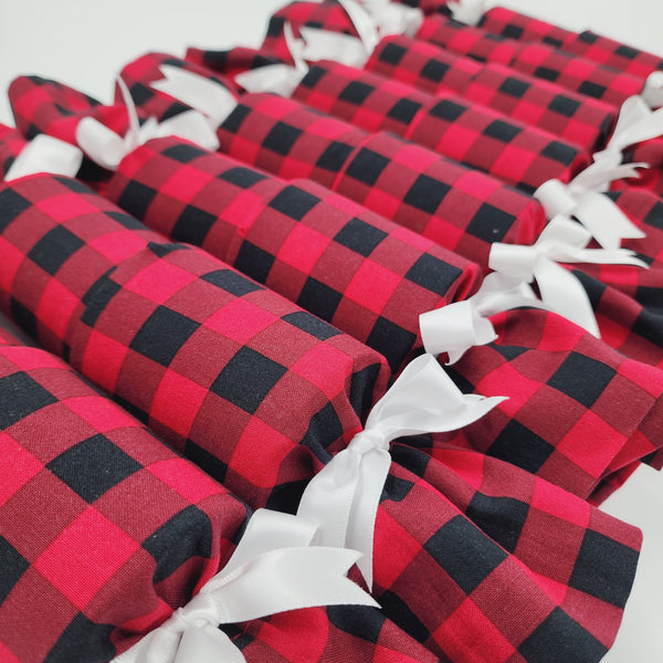 Set of eight Re-Crackers (reusable Christmas Crackers or Bon Bons) in American Plaid. This design has red and black checked fabric finished with a white satin ribbon.